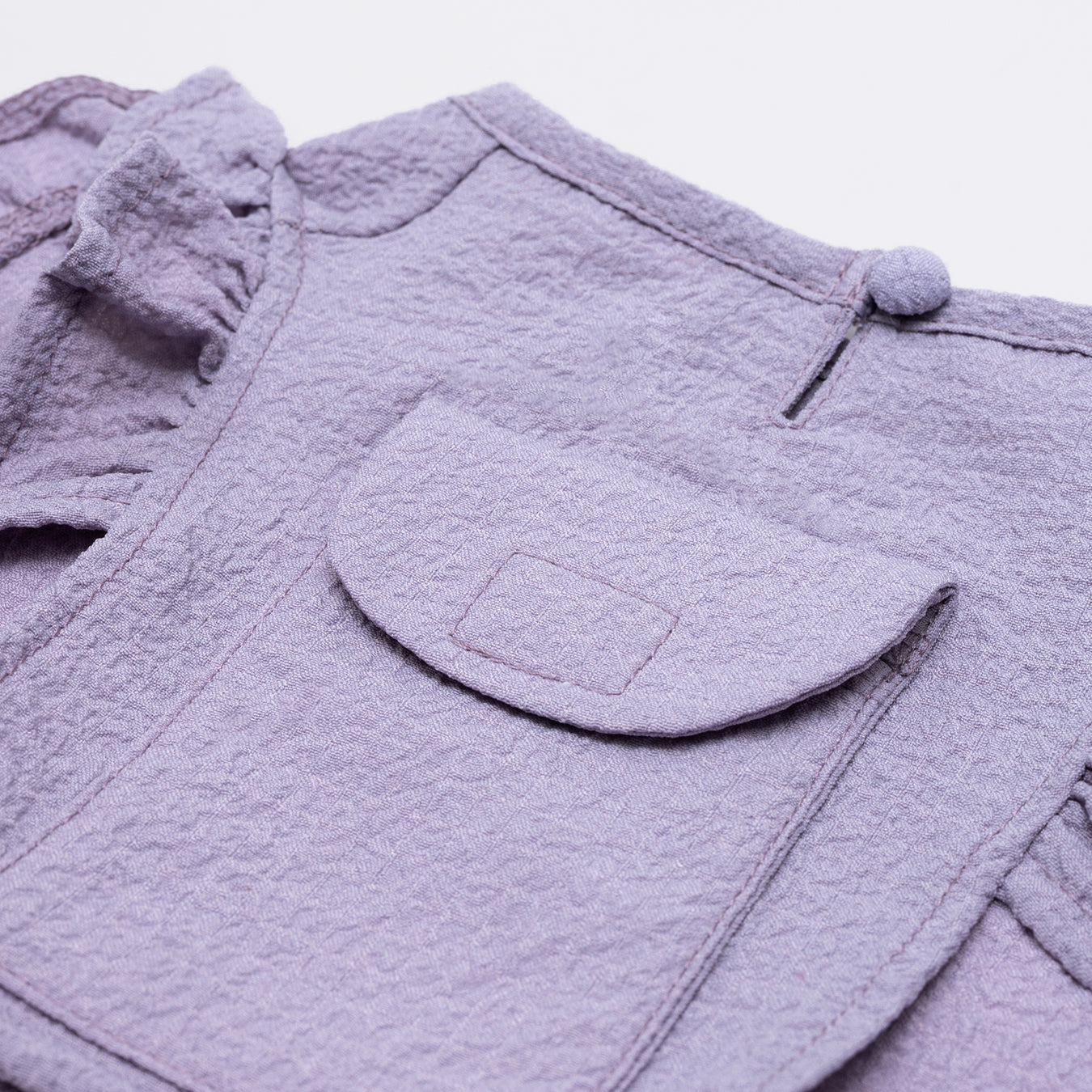 Lilac tank top vest made with lightweight, breathable fabric and ruffled detail around the edges. Adjustable Velcro waist opening for the optimal fit. Featuring a pocket for our Rounder Ice Pack to keep your pets cool from the summer heat.