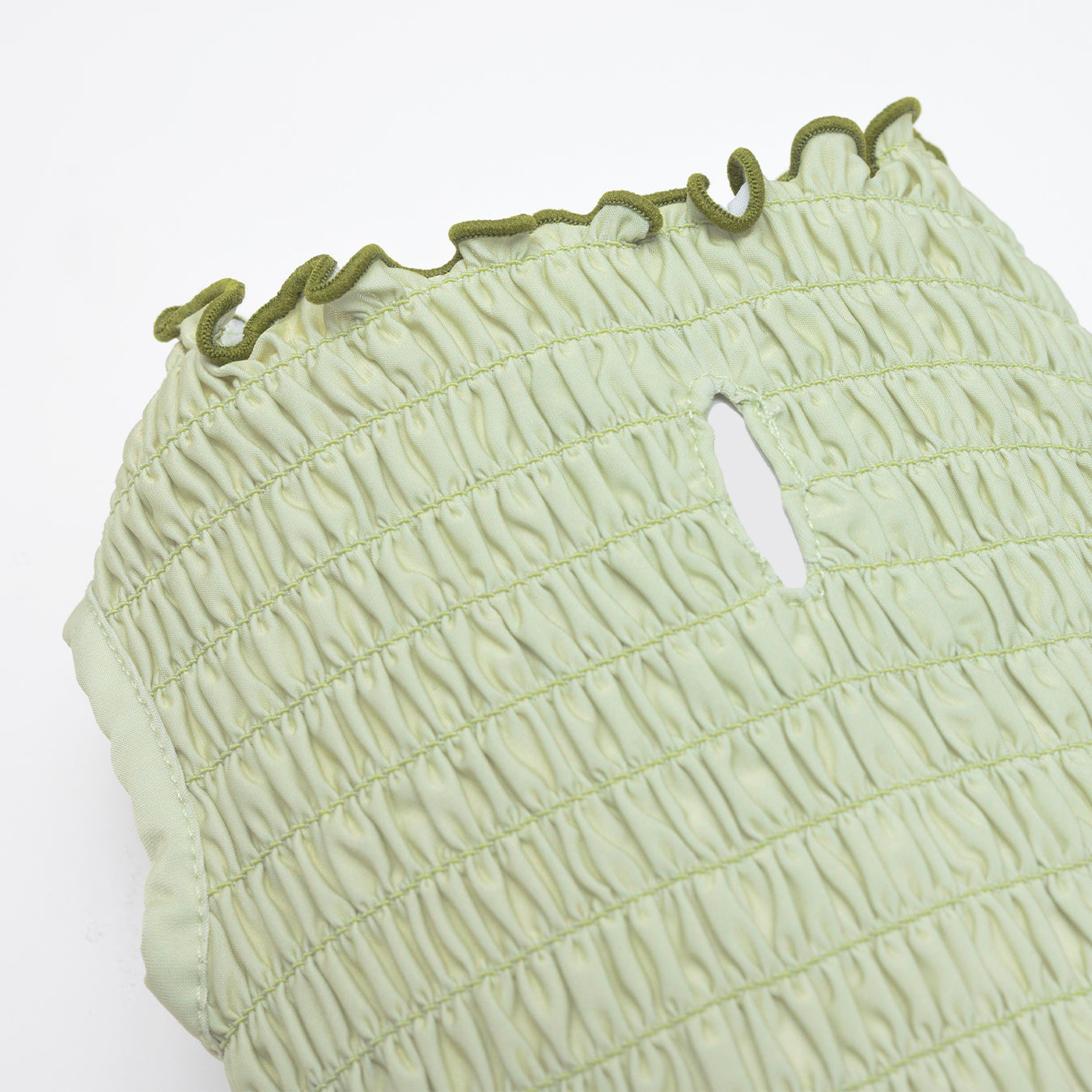 Melon green tank top made with a cool-to-touch silky fabric and smocked detail.