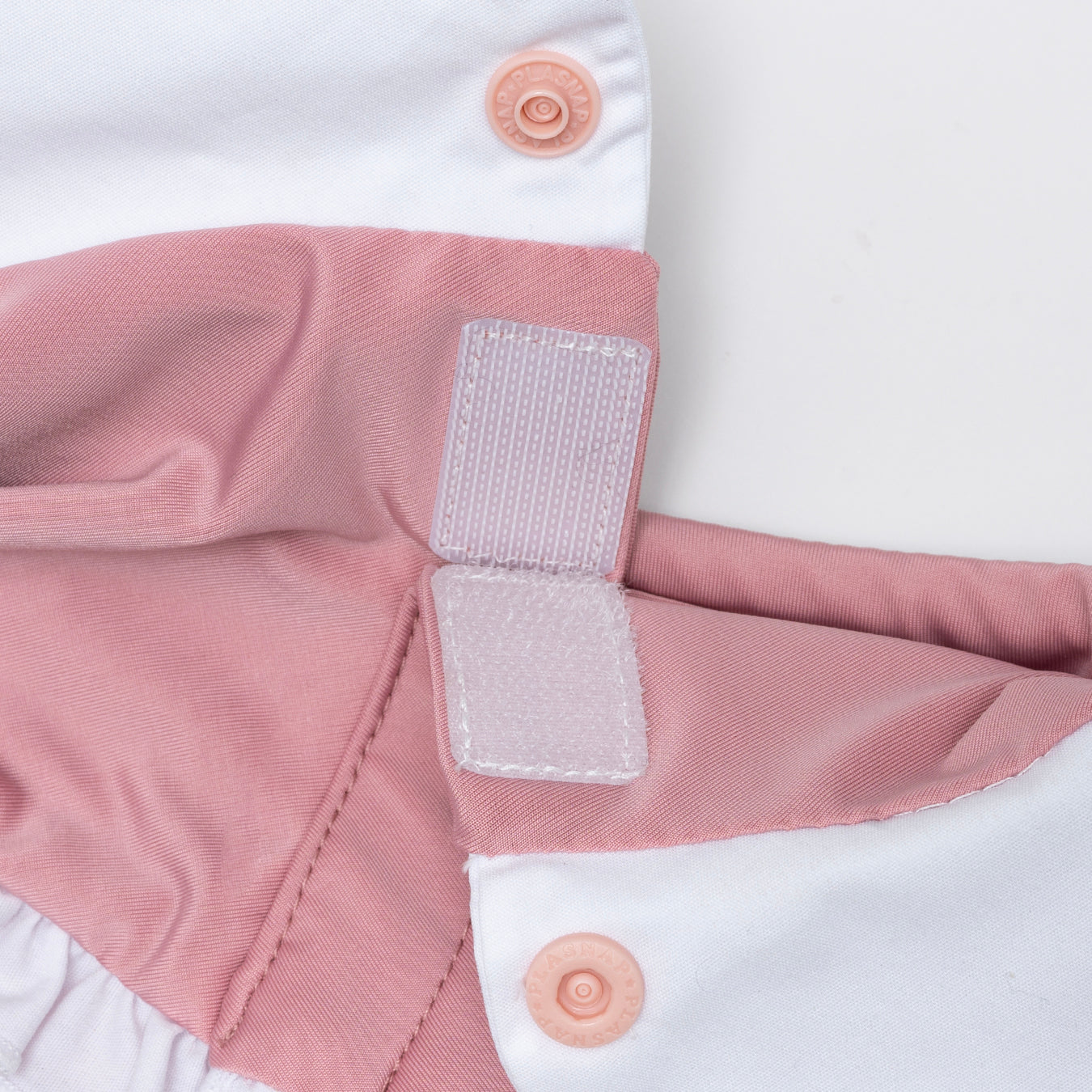 Rose pink bandana made with a cool-to-touch silky fabric. Snap button and velcro opening.